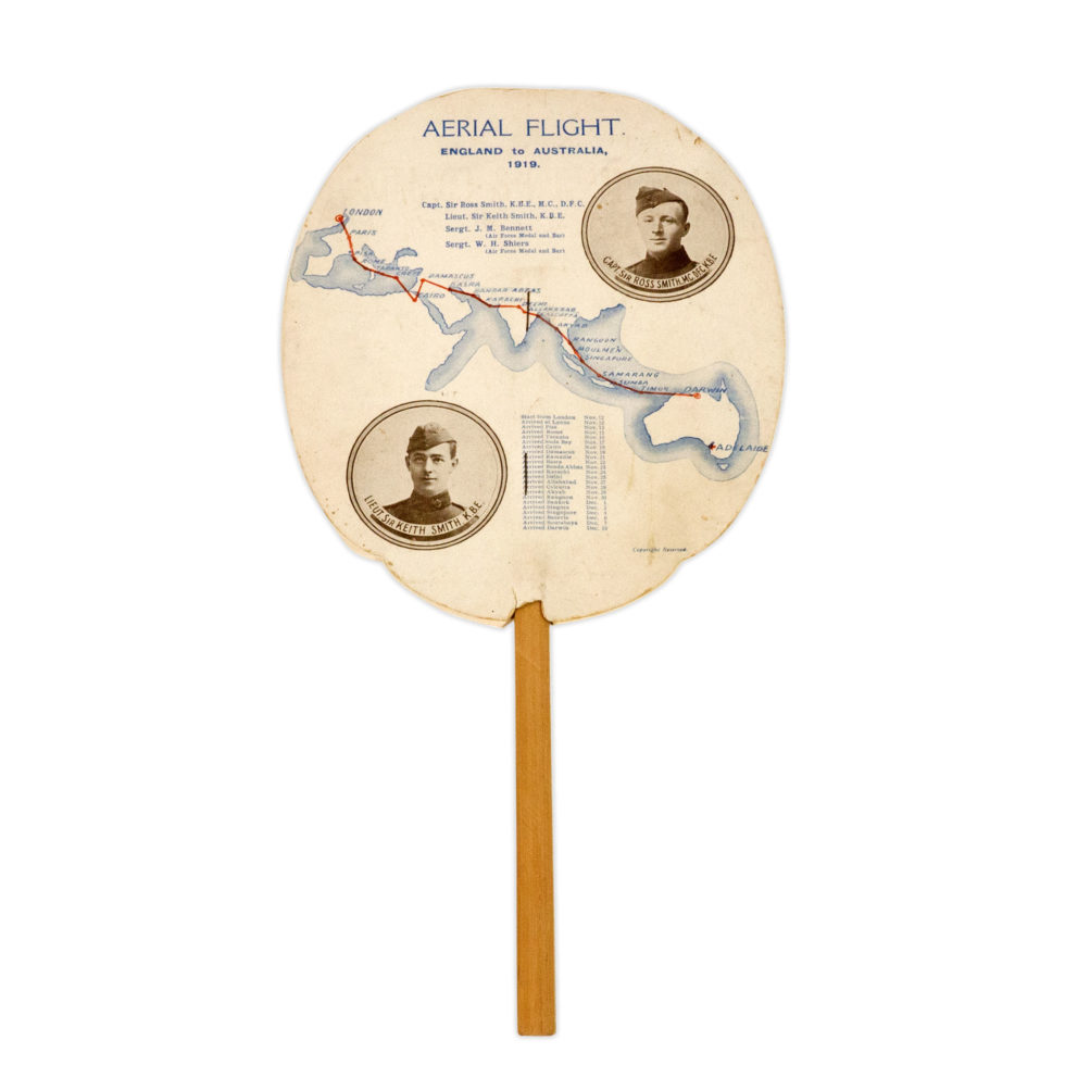 Image: paper fan on a wooden stick