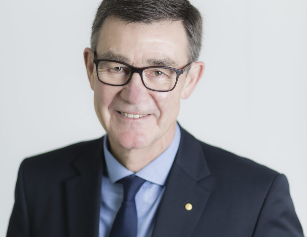 Image: head and shoulders shot of man in suit