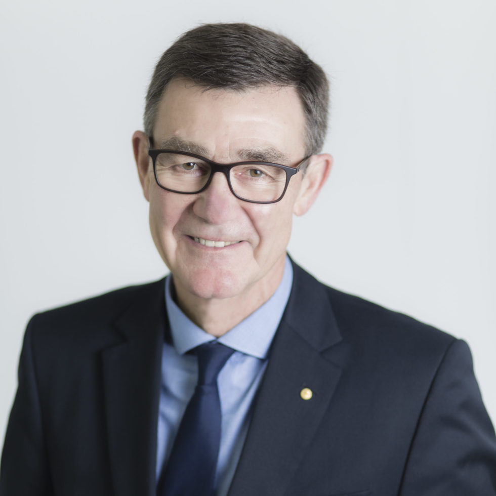 Image: head and shoulders shot of man in suit