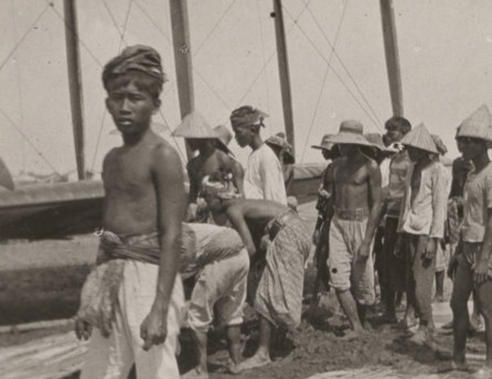 Image: Javan locals assisting with a bogged biplane