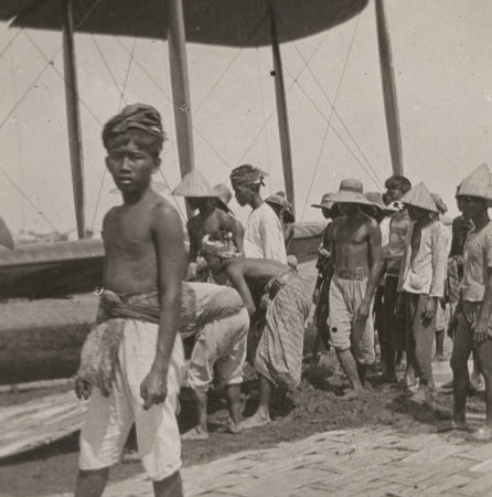 Image: Javan locals assisting with a bogged biplane